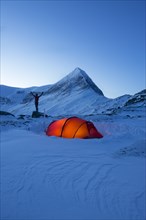 Tent with person in the snow