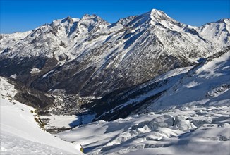 View from the Fee glacier into the valley with winter sports resort Saas-Fee