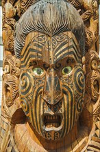 Traditional wood carved mask in the Te Puia Maori Cultural Center