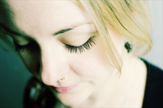 Young woman with nose piercing