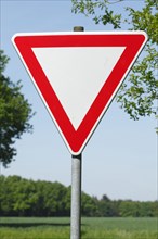 Traffic sign give right of way on a country road