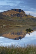 Rock formation of the Old Man of Storr with Loch Leathan