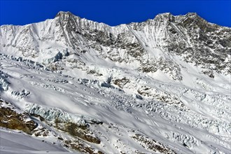 Peaks of Taschhorn and Dom of the Mischabelhorner in winter above the Feegletscher