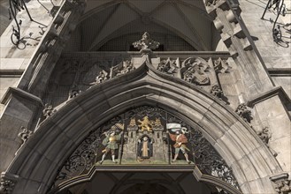 Neo-Gothic entrance portal with Munich child and Bavarian lion