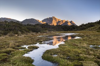 Ailsa Mountains reflected in pond at Key Summit at evening mood