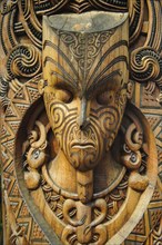 Traditional wood carved mask in the Te Puia Maori Cultural Center