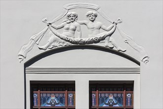Relief and stained-glass windows on a town house