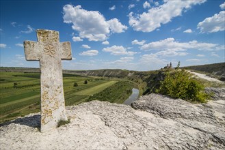 Old christian cross above the historical temple complex of old Orhei or Orheiul Vechi