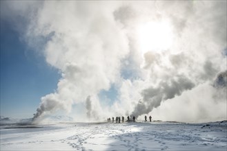 People standing by a fumarole