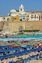 View over the beach to the Old Town with Cattedrale San Basso and Castello Svevo