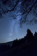 Milky Way over the mountains and forest at Schwagalp