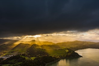 Furnassee with hilly landscape and dramatic atmospheric lighting