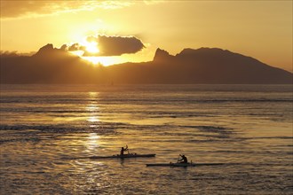 Sea kayaks on the sea at sunset
