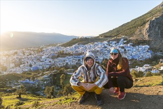 Young couple in Moroccan djellaba at lookout point