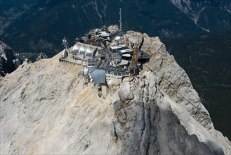 Zugspitze with the mountain stations of the cable cars and summit cross in the Wetterstein Mountains