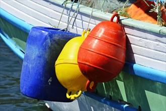 Fishing boat with colourful buoys