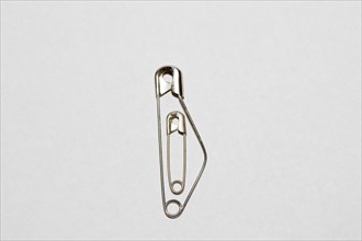 Small safety pin in a large safety pin