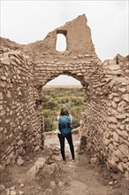 Tourist explores a ruined city