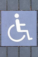 Sign for a disabled parking lot at the ground