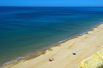 Long empty sandy beach in the Algarve