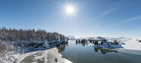 View of volcanic rock formation in the water