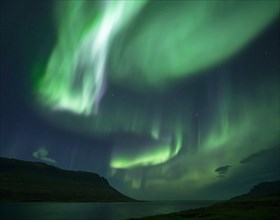 Northern lights at new moon over fjord