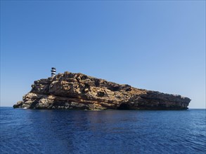 Lighthouse on the island of Na Foradada