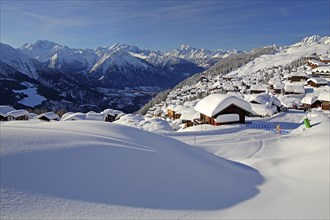 View of the village over the Rhone valley with deep snowfall