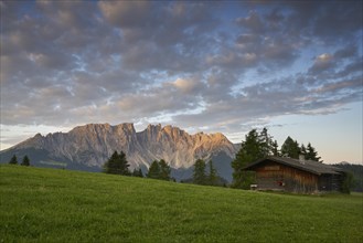 Latemar mountain range with alpine huts