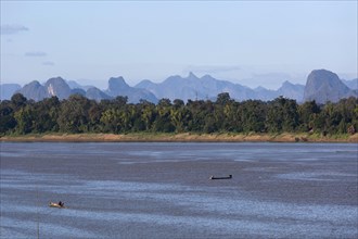 View over the border river Mekong to karst mountains in Laos