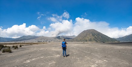 Young man in the caldera on his way to the crater of the Gnung Bromo