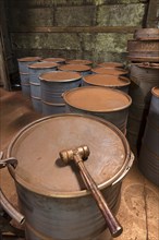 Production room for bronze powder with barrels