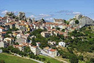 View of mountain village Pietrabbondante with medieval tower and church Chiesa di Santa Maria Assunta on rock Morg Caraceni