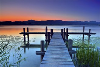 Wooden pier during dawn at Pfaffikersee