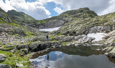 Hiker at a small lake