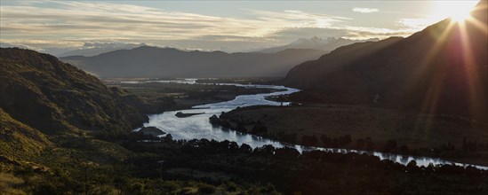 Glacier river Rio Baker at sunset with the mountains of the Andes behind