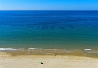 Empty sandy beach on the Algarve coast near Praia da Luz