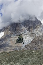 Helicopter landing at the Khan Tengri Base Camp