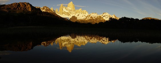 Snow-covered mountain range with Fitz Roy in the morning light