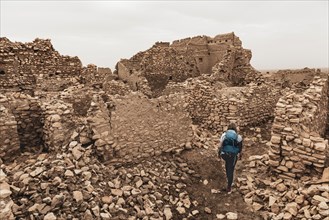 Tourist explores a dilapidated city