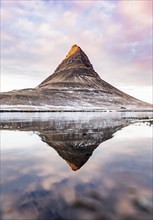 Mount Kirkjufell reflected in the water