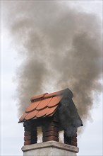 Dark smoke from a chimney
