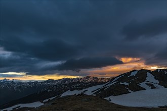 Sunrise over South Tyrolean mountains with dramatic clouds