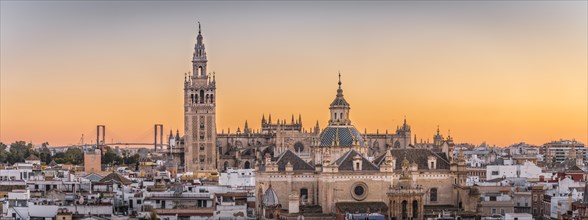 City view with views of La Giralda and Iglesia del Salvador at sunset