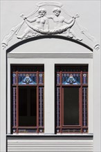 Relief and stained-glass windows on a town house