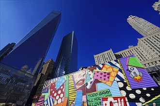 Building site with graffiti decorated walls in front of One World Trade Center Transportation Hub