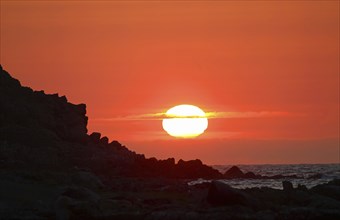 Sunset at rocky coast