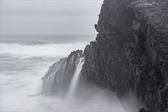 Cliffs of Dyrholey at Storm