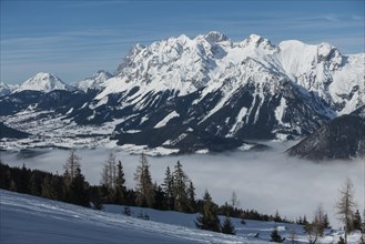 View from the Hauser Kaibling ski mountain to the Dachstein massif with the Enns valley in the fog