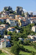 View of mountain village Pietrabbondante with medieval tower at the rock Morg Caraceni